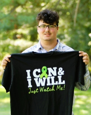 Ben holding shirt.crop